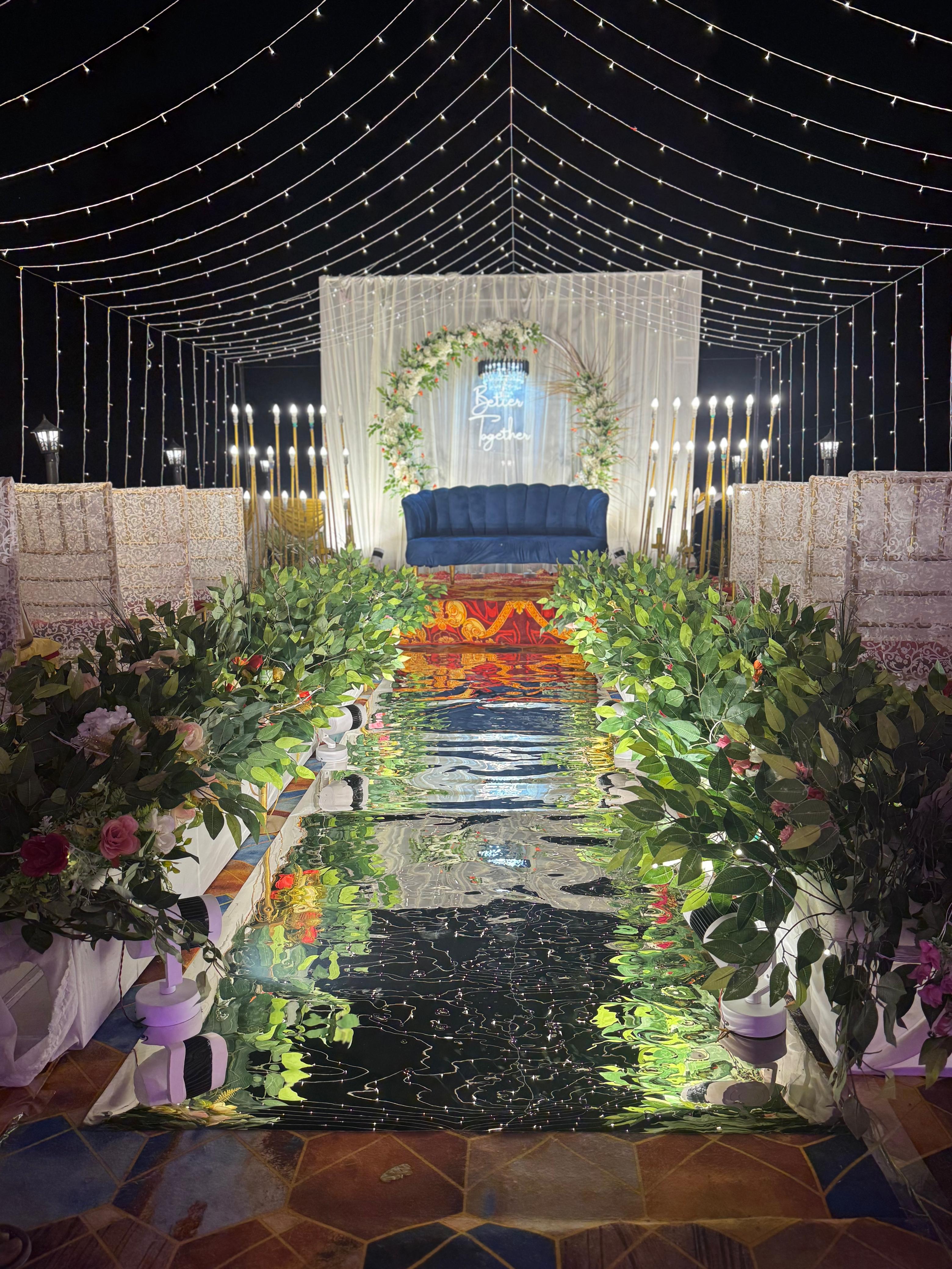 Wedding aisle with mirror floor and flower decor